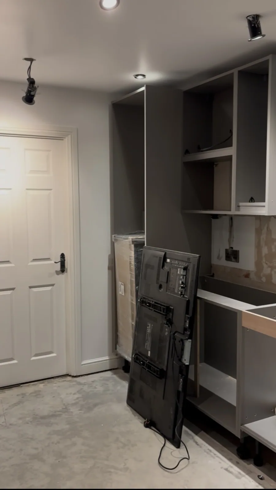 Tall cabinetry and appliance housings in progress